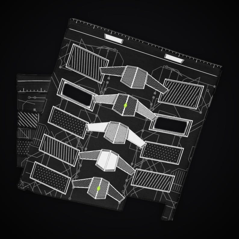 May include: A black rectangular mat featuring a white technical blueprint design. The pattern includes various geometric shapes, rectangular frames with diagonal stripes or dots, and five symmetrical shield-like icons with small green accents.