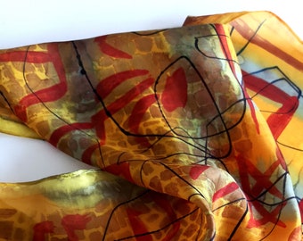 Hand-painted scarf made of silk with shades of grey, red, and yellow by SilkArtidea