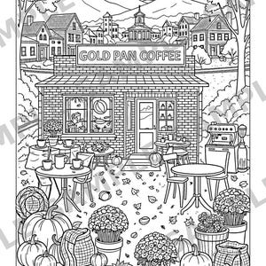 Może przedstawiać: Czarno-biała kolorowanka przedstawiająca ceglaną witrynę sklepową z napisem GOLD PAN COFFEE. Scena zawiera stoliki, krzesła, dynie, kwiaty w doniczkach i ekspres do kawy, a w tle widać małe miasteczko i g&oacute;ry.