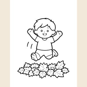 May include: A black and white line art illustration of a child with short hair, wearing a t-shirt and shorts, jumping with arms raised above a pile of fallen leaves. The drawing features bold outlines and simple shapes, creating a clear, high-contrast coloring page design.