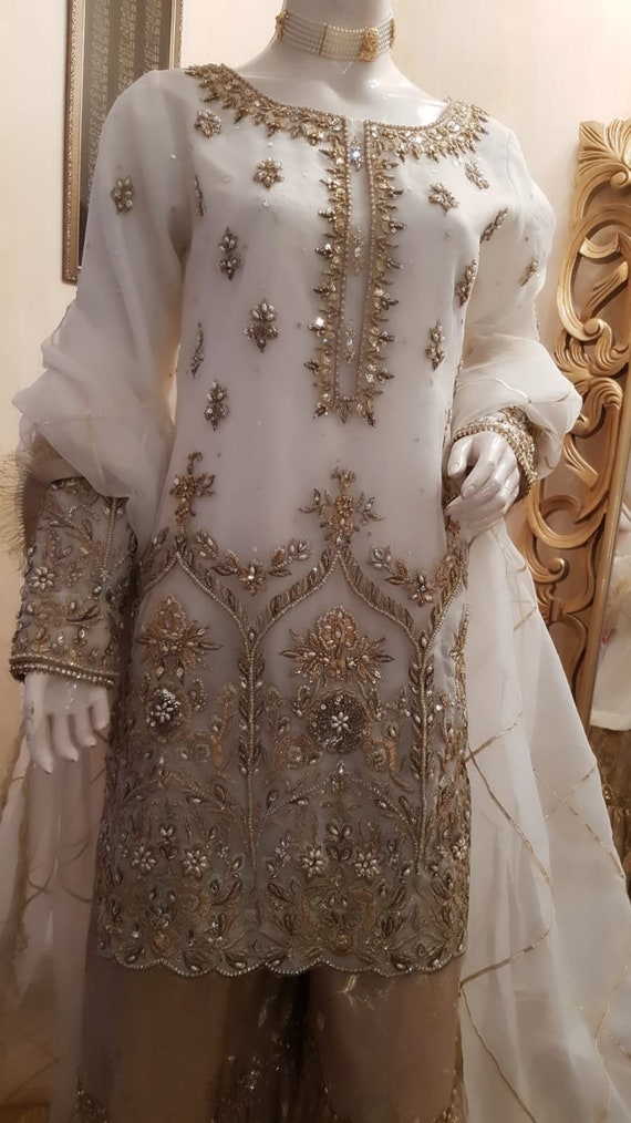 White and gold store pakistani bridal dress