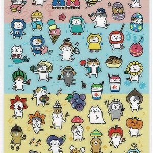 May include: Sheet of Mind Wave Seals stickers featuring various cat characters dressed in costumes. The stickers include cats dressed as a frog, a bee, an ice cream cone, and a snowman. The stickers are on a pink, blue, and yellow background.