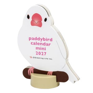 May include: A white bird-shaped mini desk calendar for 2027, featuring a pink beak and eyes, perched on a brown branch element. The text reads paddybird calendar mini 2027 and Greeting Life Inc. It is supported by a round, light beige base.
