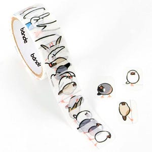 May include: Washi tape roll with a repeating pattern of cartoon birds in various colours. The tape is white with the brand name "bande" printed on the side. Several individual bird stickers are also visible.