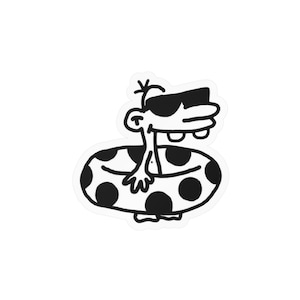 Puede incluir: Una pegatina en blanco y negro que muestra un personaje de dibujos animados con una nariz grande y dos dientes prominentes que lleva gafas de sol oscuras. El personaje está dentro de un flotador circular con puntos negros.