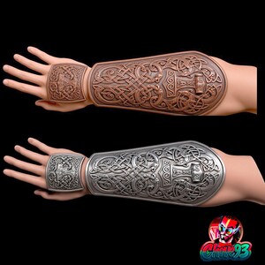 May include: A pair of forearm bracers and matching hand plates featuring intricate Celtic knotwork and a central hammer motif. One set is finished in a metallic copper tone, while the other set is finished in a metallic silver tone.