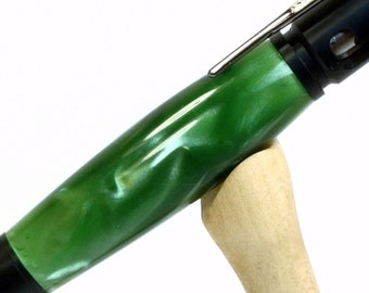 Green bolt action pen in black setting