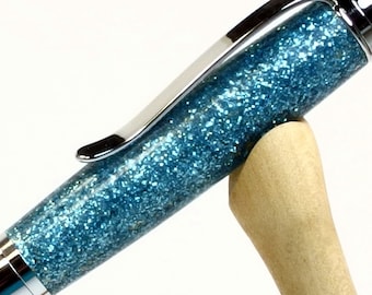 Blue glitter pen in chrome setting