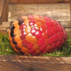 Red Dragon Egg fades to orange and black stripes image 1