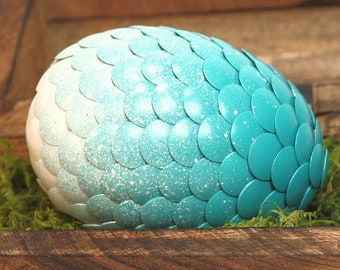 Teal Dragon Egg fades to white