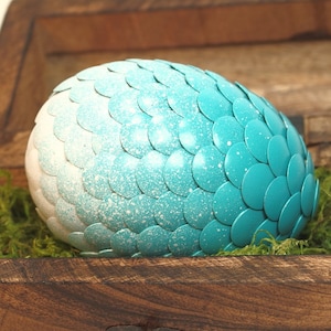 Teal Dragon Egg fades to white