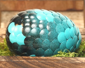 Teal Dragon Egg fades to black