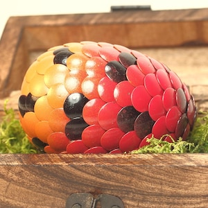 Red Dragon Egg fades to orange with black accent scales
