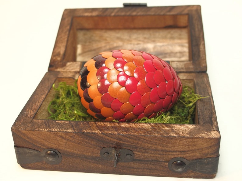 Red Dragon Egg fades to orange and black stripes image 1