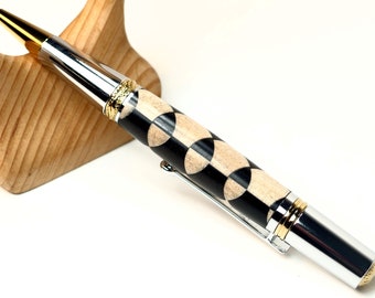 Harlequin wood pen in chrome and gold setting