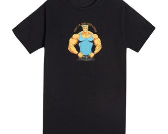 May include: A black short-sleeved t-shirt featuring a graphic of a muscular person with blonde hair wearing a light blue tank top. The text "Protein, Lift, Sleep, Rinse & Repeat" is printed in an arc above the figure's head.