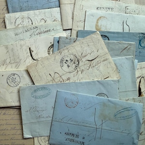 May include: A collection of vintage envelopes in various shades of blue and cream. The envelopes feature handwritten script, stamps, and postmarks, creating a nostalgic aesthetic. Some envelopes have the city names like Montauban and Geneva.