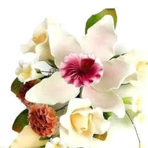 May include: A bouquet of white and cream colored silk flowers, including orchids, roses, and carnations. The bouquet also features a pink and red orchid with a darker center.