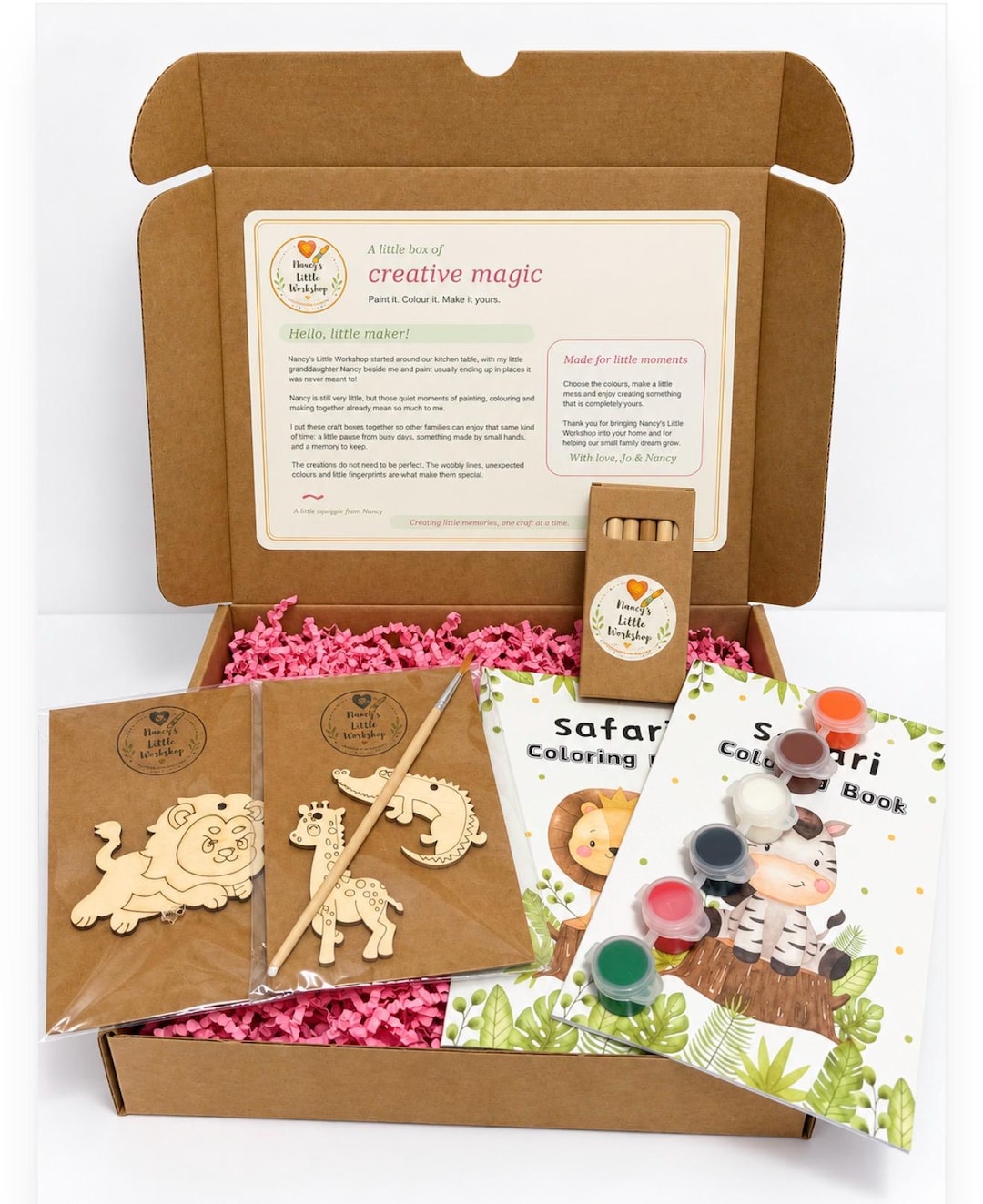 Safari craft kit with wooden lion, giraffe and crocodile shapes, pencils, a paintbrush and a safari colouring book