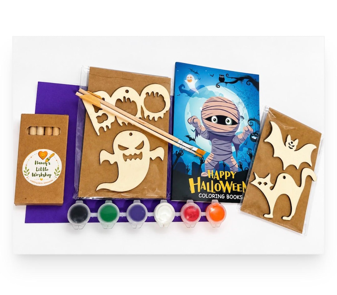 Halloween gift box with a colouring book, wooden ghost, bat and cat shapes, paintbrushes and paint pots