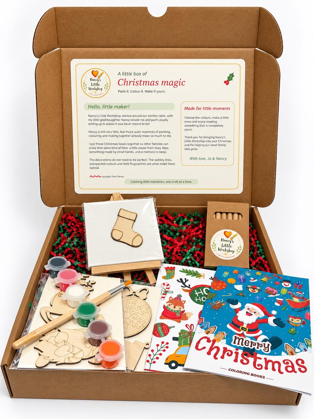 Christmas Eve Box with a colouring book, wooden stocking on an easel, paints, brush, wooden ornaments and pencils