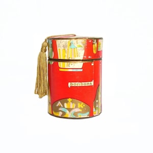 Caja de dulces austriaca redonda y alta de cartón. Caja vintage Kühne con papel litografiado y borla.