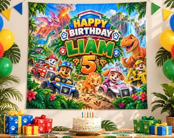May include: A rectangular birthday backdrop featuring Paw Patrol characters and dinosaurs in a jungle setting. The text reads Happy Birthday Liam 5. Below the backdrop is a white frosted cake with five lit candles and several gift boxes.
