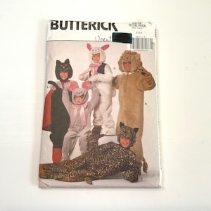 May include: A Butterick sewing pattern envelope for children's animal costumes, featuring illustrations of a black cat, a white rabbit, a grey mouse, a tan lion, and a leopard print jumpsuit. The package includes a barcode and size range 2-3-4.