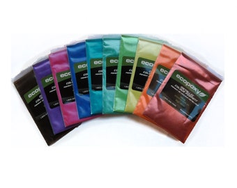 May include: A set of 10 metallic epoxy color pigments in various colors, including black, pink, blue, teal, green, yellow, orange, and copper. The pigments are packaged in small, clear plastic bags with a white label that reads "ecopoxy Metallic Color Pigment".