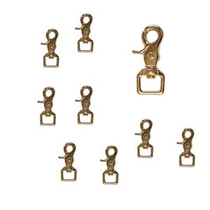 May include: A collection of nine gold-colored swivel snap hooks, each with a spring-loaded clasp and a rectangular loop. The hooks are arranged against a white background, showcasing their metallic finish and design.