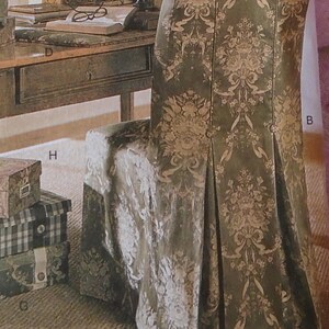 May include: A vintage sewing pattern for a chair cover featuring a floral design. The pattern is labelled "4043 Butterick Waverly" and includes instructions for creating a chair cover with a pleated skirt.