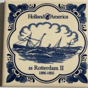 May include: A square ceramic tile with a blue and white design. The tile features the text "Holland America" and an illustration of the ss Rotterdam II ship. The ship is depicted sailing on wavy lines, with the years 1886-1895 below.