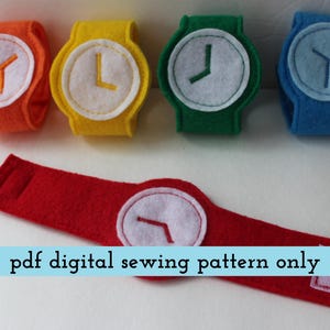 May include: A collection of colorful felt toy watches in orange, yellow, green, and blue, with white watch faces and hands. A red watch band with a white watch face is also shown. The text "pdf digital sewing pattern only" is displayed.