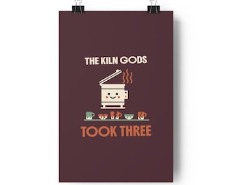 May include: A dark maroon poster featuring a smiling kiln illustration with steam rising from the top. Below the kiln, five small ceramic items are displayed, including broken pieces. The text reads THE KILN GODS TOOK THREE in cream and orange.