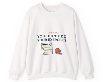 May include: A white long-sleeve sweatshirt featuring the text I CAN TELL YOU DIDN'T DO YOUR EXERCISES in dark blue and orange. Below the text is a graphic of a checklist with a spiderweb in the corner and a rolled-up orange exercise band.