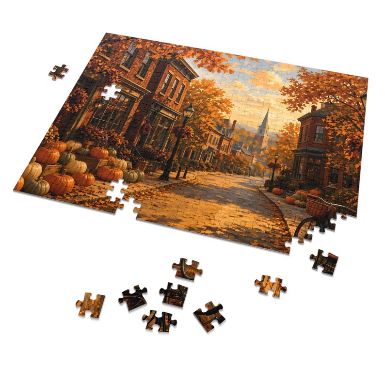 Rompecabezas "Cozy Cottage Seasons Autumn Main Street", "Pueblo pequeño", caja de metal (252 piezas) imagen 2