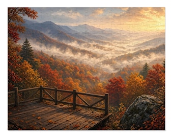 May include: A jigsaw puzzle depicting a wooden deck with a railing overlooking a mountain valley during autumn. The scene features vibrant orange and red trees, rolling hills covered in morning mist, and a golden sunrise sky.