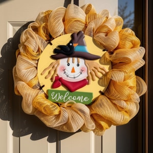 May include: A decorative wreath made of yellow and tan mesh fabric featuring a central circular sign with a scarecrow illustration wearing a hat and a black bird, with the word Welcome printed in white script on a green rectangular base.