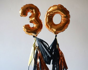 Mini gold foil mylar balloon with tassels cake topper table number