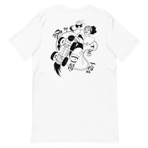 May include: White t-shirt featuring a black and white illustration of a person roller skating. The graphic shows the skater mid-air, with palm trees and a stylized trail. The skater is wearing protective gear and a headband.