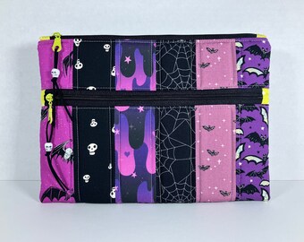 Large Padded Double Zipper Pouch with Faux Suede Zip Pull and Skull Beads. 8.5 x 11.5 inches. Ruby Star Spooky Darlings. Purple + Black.