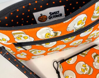 3 Piece Halloween Wristlet Set. Skulls Double Zip Pouch + Coin Pouch and Removable Wrist Lanyard. Created with Vintage Halloween Fabric!