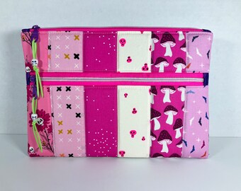 Large Two-Tone, Padded Double Zipper Pouch with Faux Suede Zip Pulls and Skull Beads. 8.5 x 11.5 inches. Ruby Star Halloween. Pink + Black.