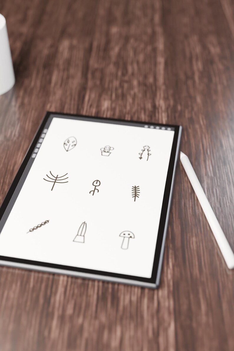 May include: A digital tablet with a white screen displaying nine black line-art icons of plants and nature elements, including a leaf, cactus, flower, tree, and mushroom, accompanied by a white stylus resting on the side.