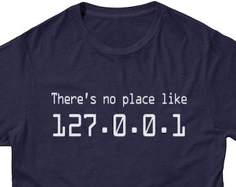May include: A navy blue t-shirt with white text that reads "There's no place like 127.0.0.1".