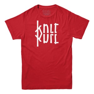 May include: Red short-sleeved t-shirt with a white graphic that says "knit kurl" in a stylized font.
