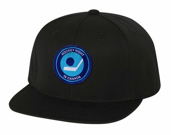 May include: Black baseball cap with a blue and white embroidered patch that says "Hockey Night in Canada".