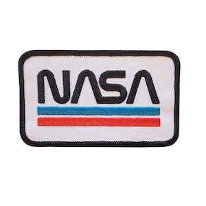 May include: A white embroidered patch with a black NASA logo and red and blue stripes.