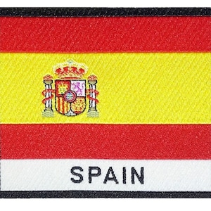 Peut inclure: Un patch brodé représentant le drapeau espagnol, avec les armoiries et le mot "ESPAGNE" en lettres noires.