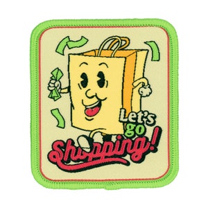 May include: An embroidered patch featuring a cartoon shopping bag character. The bag has a smiling face and is holding money. The text "Let's go Shopping!" is written in red and black.